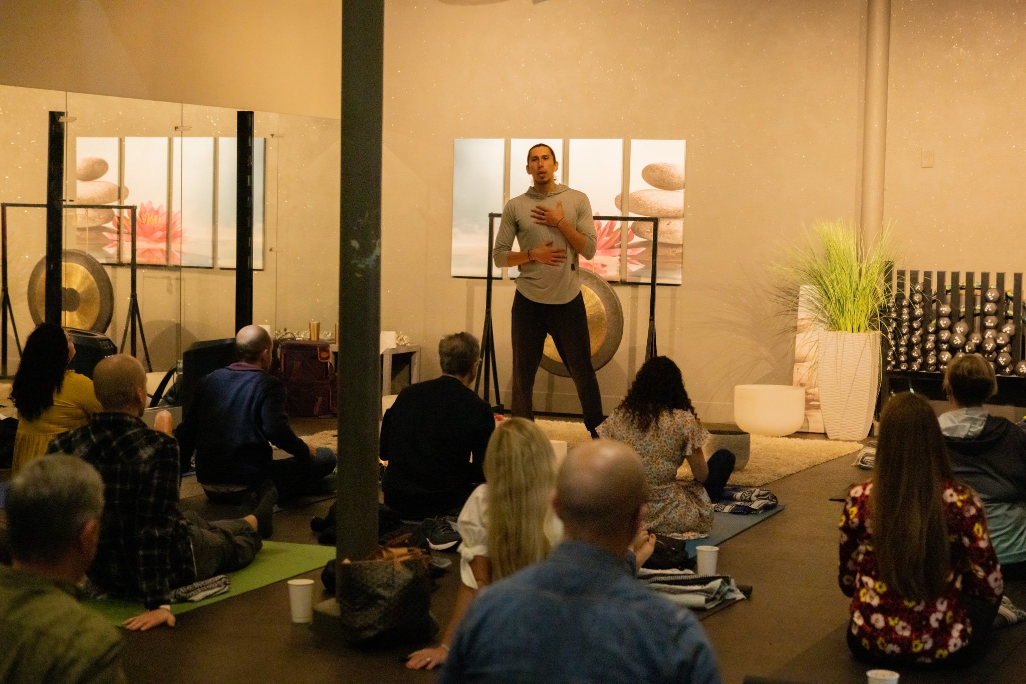 Participants resting together during a guided breathwork session