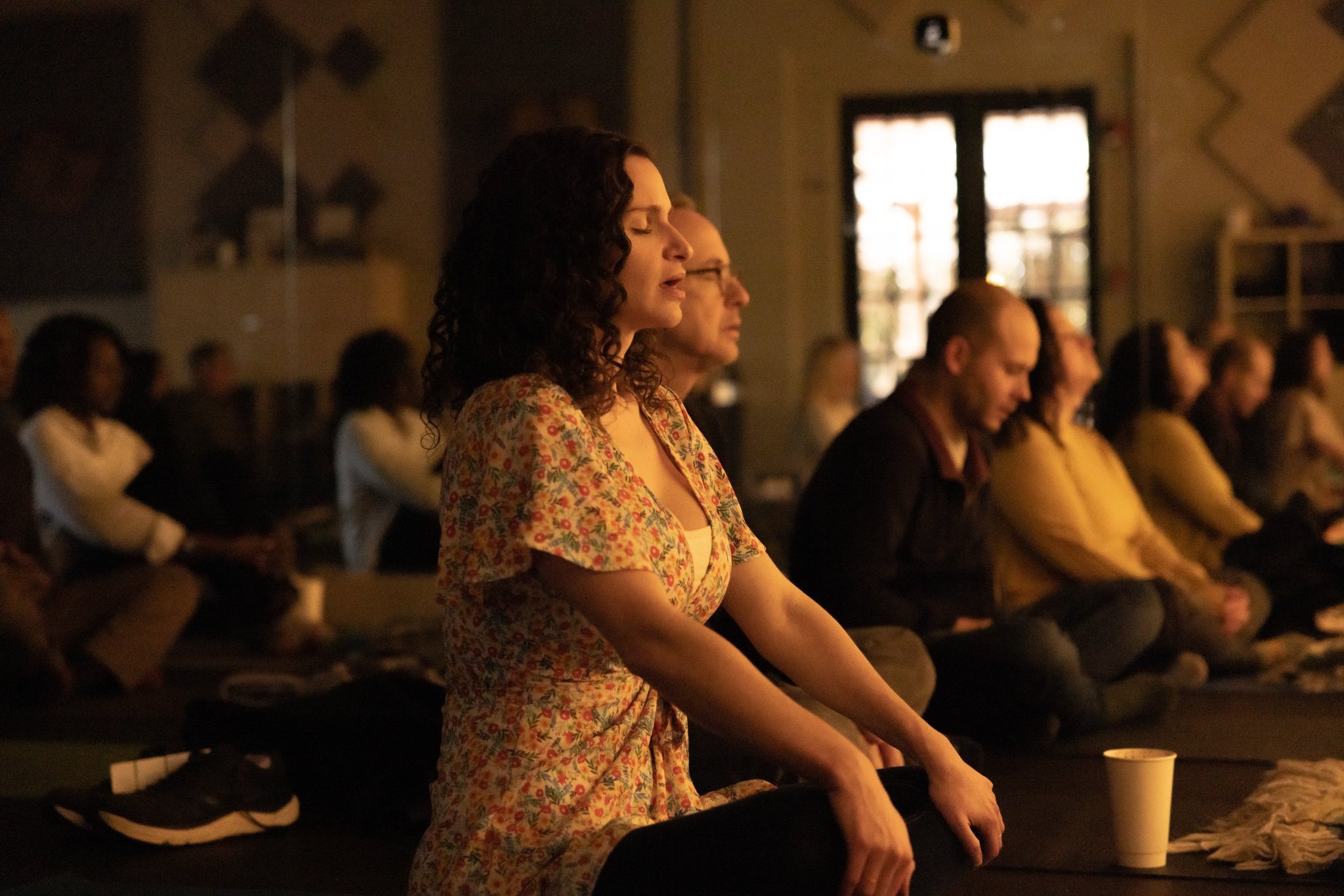 Participants settling into a guided breathwork practice